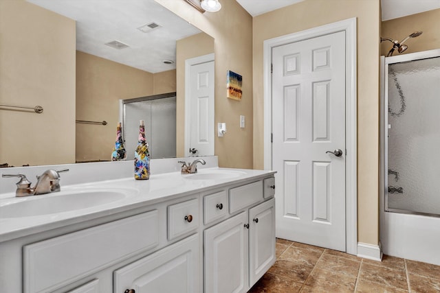 bathroom featuring vanity and enclosed tub / shower combo