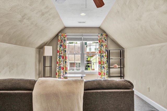 interior space with ceiling fan and lofted ceiling