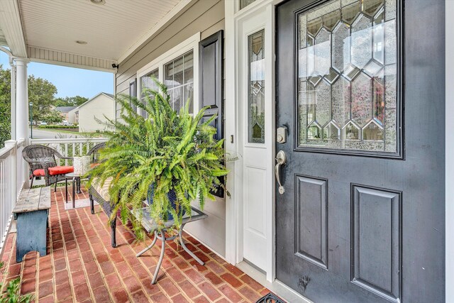 entrance to property featuring a porch