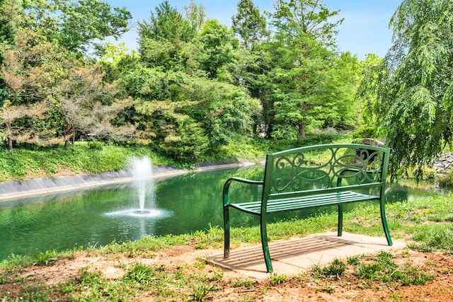 surrounding community with a water view