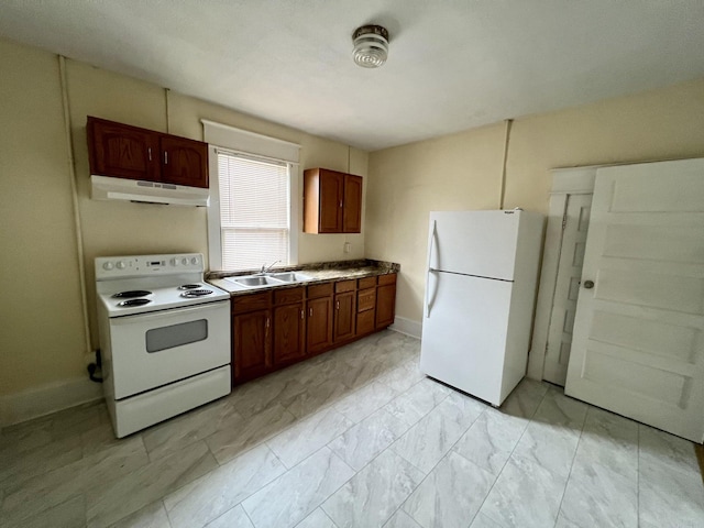 kitchen featuring light tile patterned flooring, sink, and white appliances