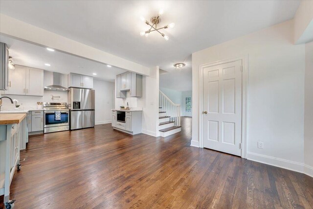 living room with sink and dark wood-type flooring