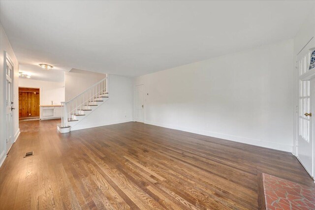 unfurnished living room featuring wood-type flooring