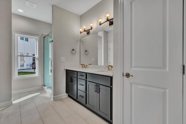 2240 Foxfield Ln, Salem, VA 24153 - full bath with baseboards, a tile shower, double vanity, and a chandelier