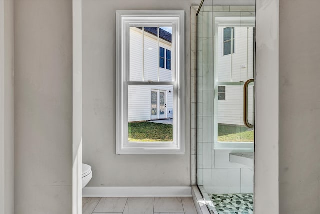 2240 Foxfield Ln, Salem, VA 24153 - bathroom featuring baseboards, marble look tile flooring, toilet, and a shower