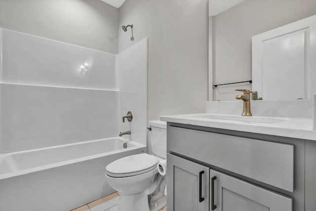 full bathroom featuring tile patterned floors, vanity, toilet, and washtub / shower combination