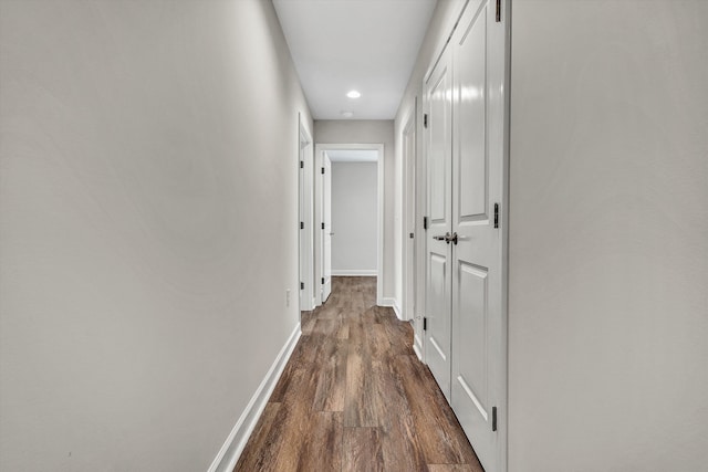 hall with dark hardwood / wood-style flooring