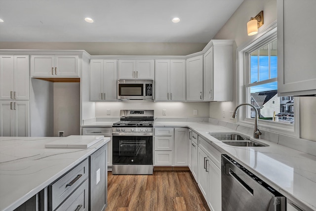 2240 Foxfield Ln, Salem, VA 24153 - kitchen featuring appliances with stainless steel finishes, a sink, white cabinets, dark wood finished floors, and recessed lighting
