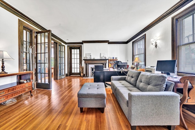 living room featuring ornamental molding, french doors, and wood-type flooring