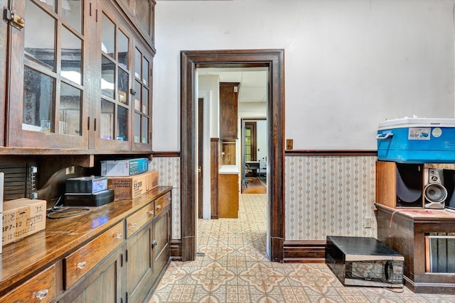 corridor featuring light tile patterned floors