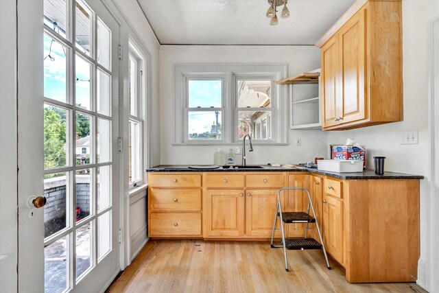 kitchen featuring light hardwood / wood-style floors, sink, plenty of natural light, and light brown cabinets