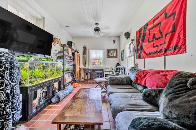 tiled living room with ceiling fan