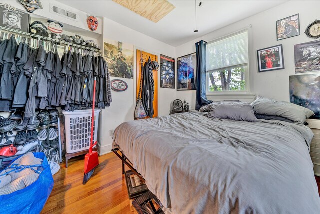 bedroom featuring a closet and wood-type flooring