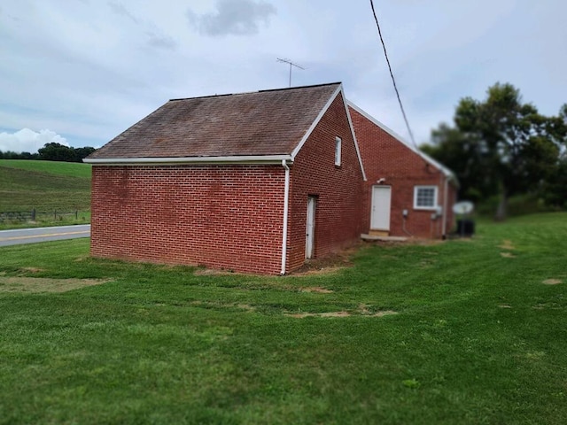 view of property exterior with a lawn