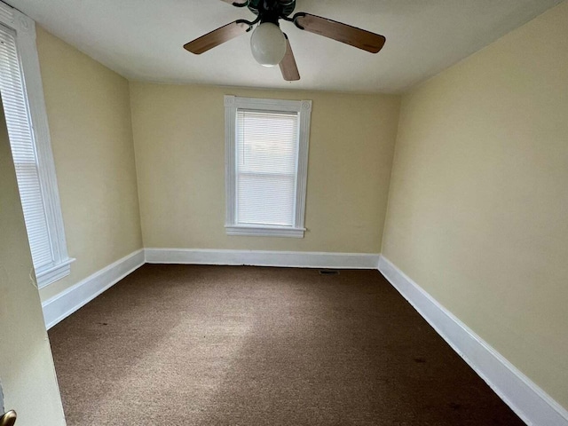 carpeted empty room with ceiling fan