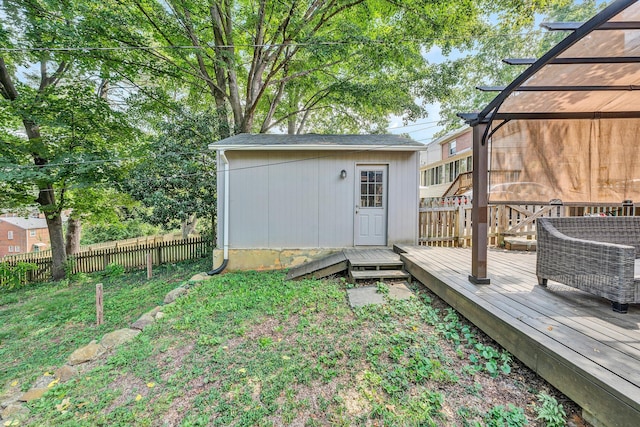 view of yard featuring a wooden deck and a shed