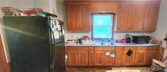 kitchen featuring black appliances and sink