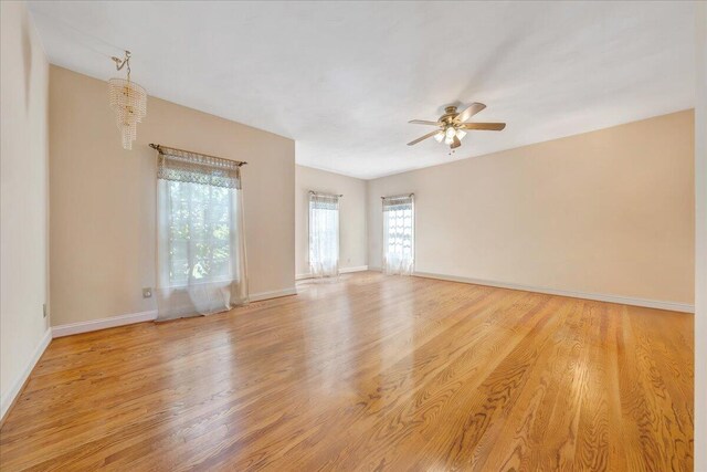 unfurnished room featuring ceiling fan and light wood-type flooring