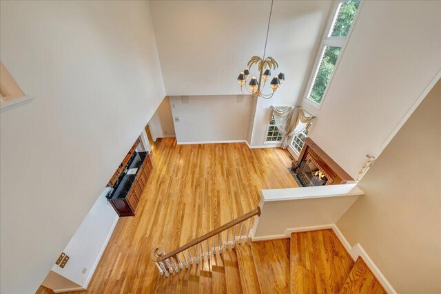 interior space with an inviting chandelier and hardwood / wood-style floors