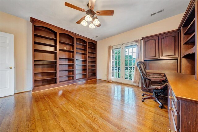 unfurnished office featuring ceiling fan and light hardwood / wood-style flooring