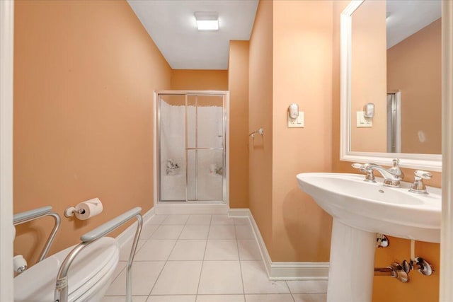 bathroom with tile patterned flooring, an enclosed shower, and toilet