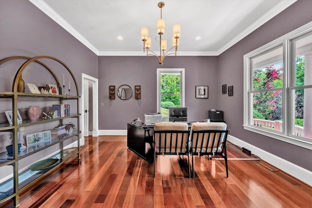 dining area featuring a chandelier, ornamental molding, and hardwood / wood-style flooring