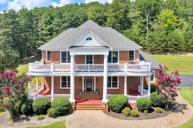 view of front of house with a balcony and a porch