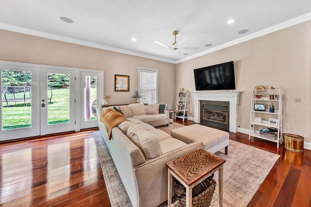 living room with ceiling fan, french doors, hardwood / wood-style flooring, and crown molding