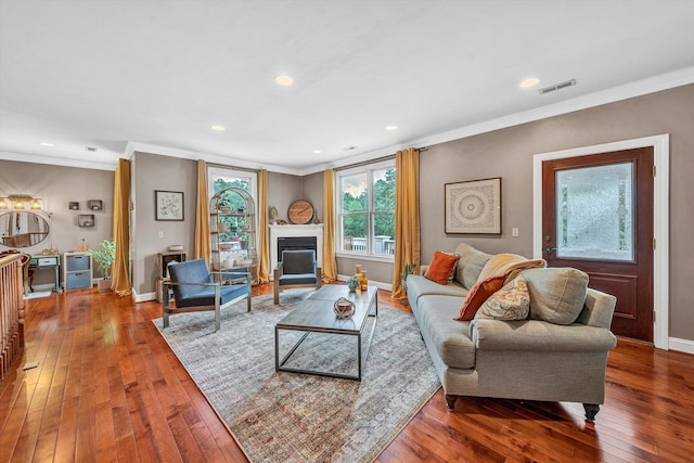 living room featuring ornamental molding and hardwood / wood-style flooring