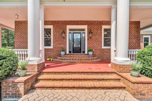 doorway to property featuring covered porch