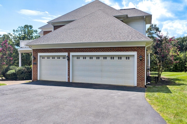 garage featuring a lawn