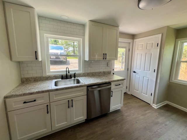 kitchen with sink, a healthy amount of sunlight, dishwasher, and hardwood / wood-style floors