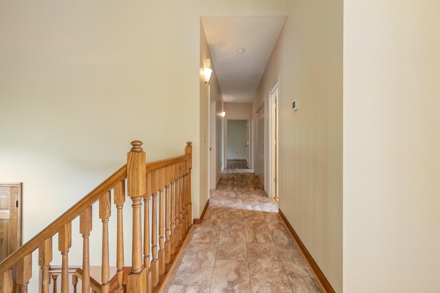 hallway with light tile patterned floors