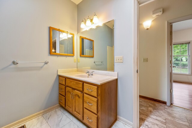 bathroom with tile patterned floors and vanity