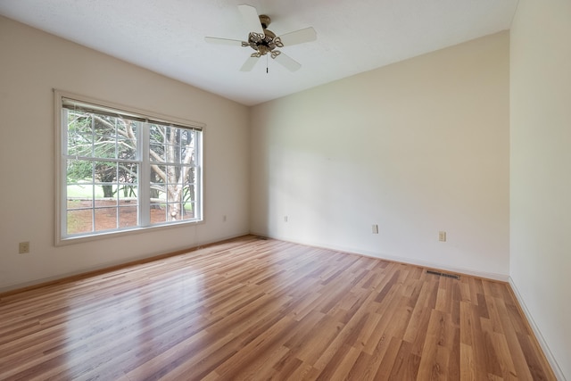 unfurnished room featuring light hardwood / wood-style floors and ceiling fan