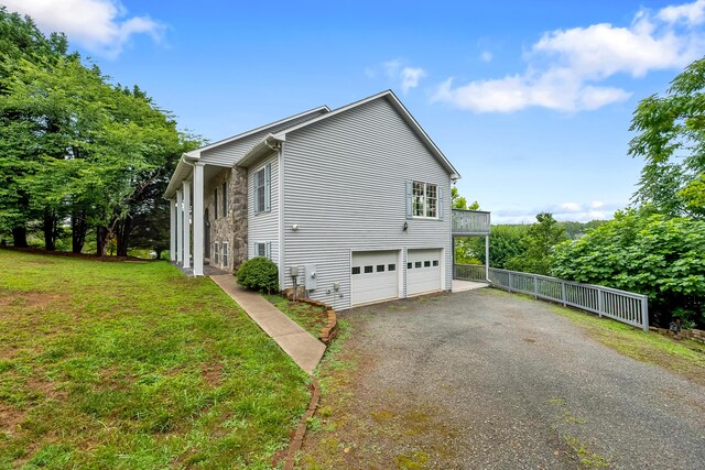 view of property exterior with a yard and a garage