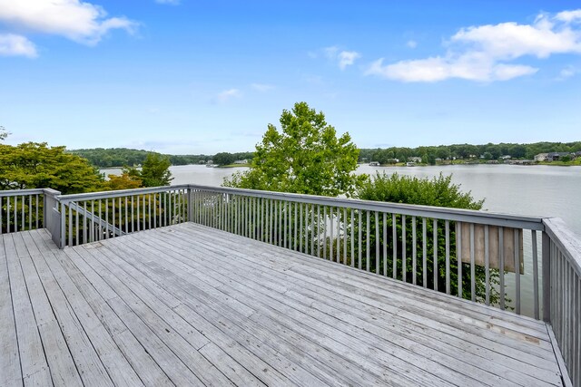 wooden deck with a water view