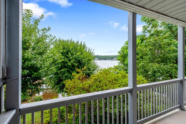 balcony featuring a water view