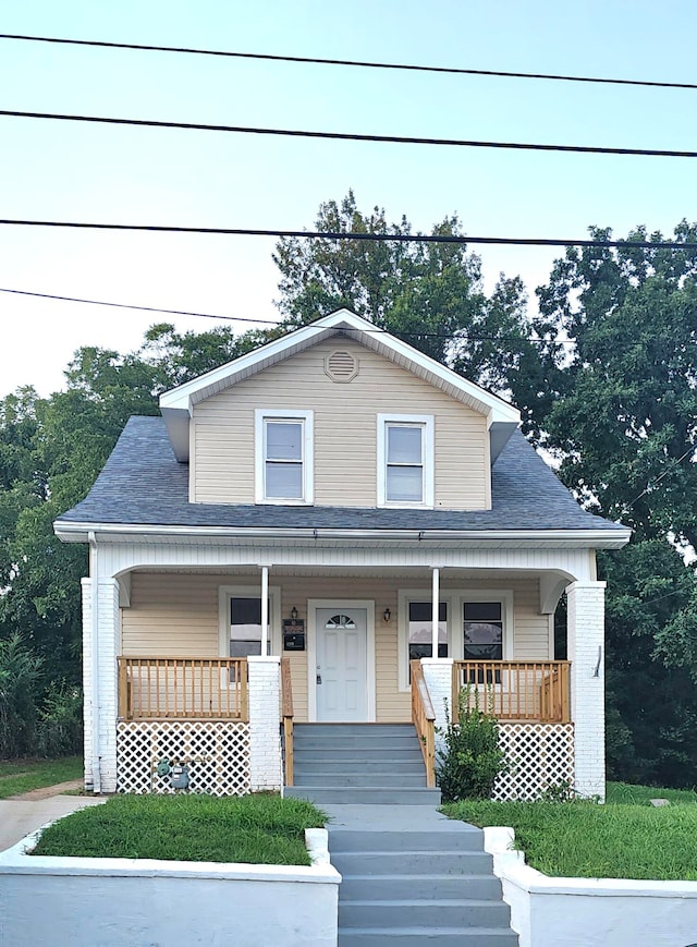 view of front of property featuring covered porch