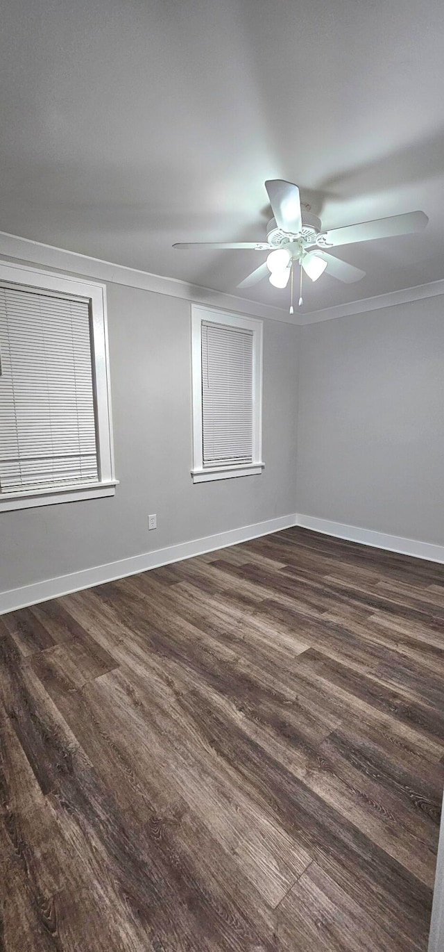 spare room featuring ceiling fan, hardwood / wood-style flooring, and ornamental molding