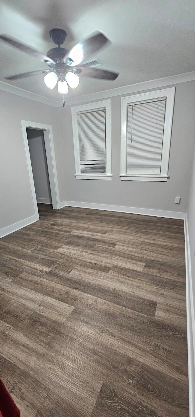 spare room featuring ceiling fan and hardwood / wood-style floors