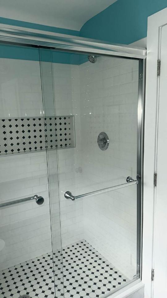 bathroom featuring an enclosed shower