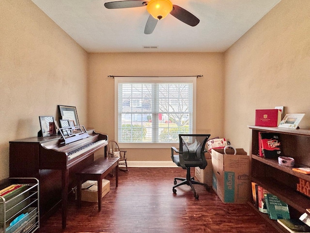 office space with ceiling fan and dark wood-type flooring