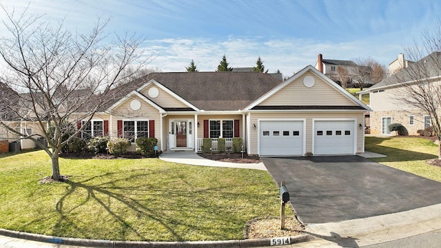 view of front of house with a garage and a front lawn