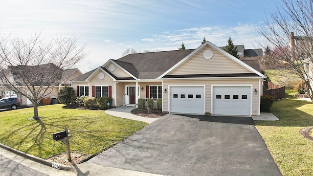 ranch-style house with a garage and a front lawn