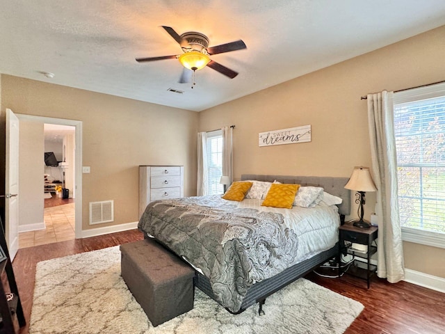 bedroom featuring ceiling fan and hardwood / wood-style floors