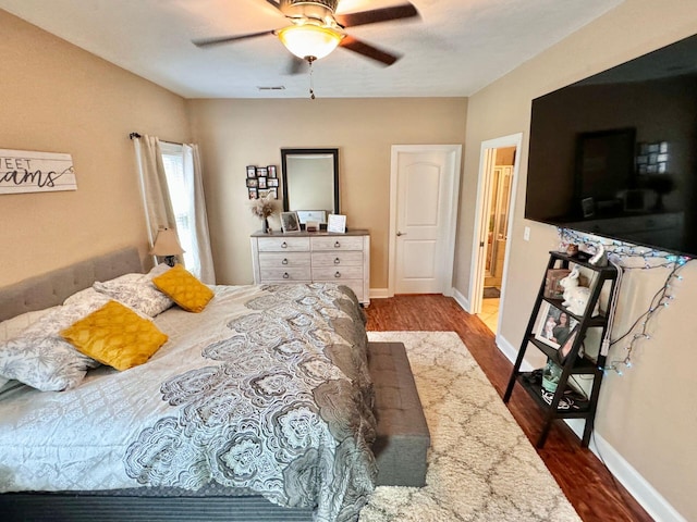 bedroom featuring ceiling fan and hardwood / wood-style floors