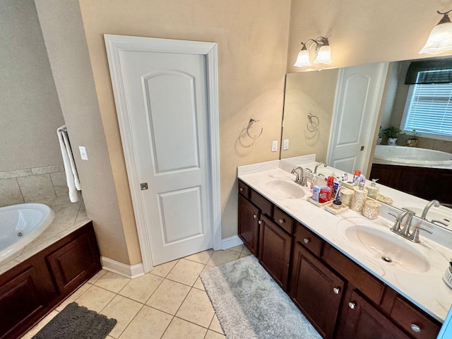 bathroom with a bathtub, double sink vanity, and tile patterned flooring