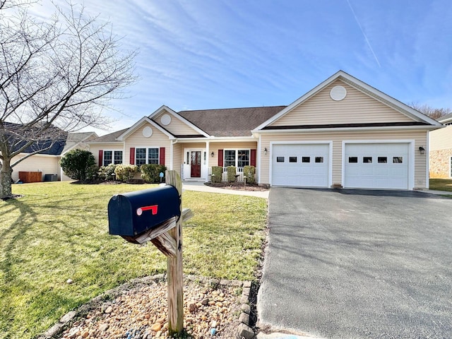 single story home featuring a garage and a front lawn