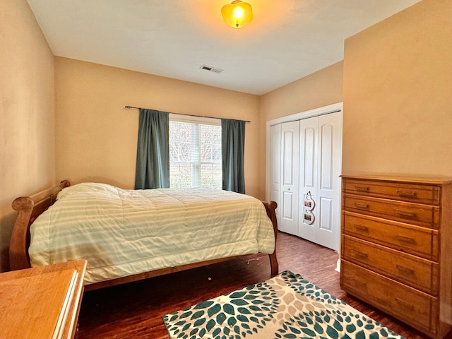 bedroom with a closet and hardwood / wood-style flooring